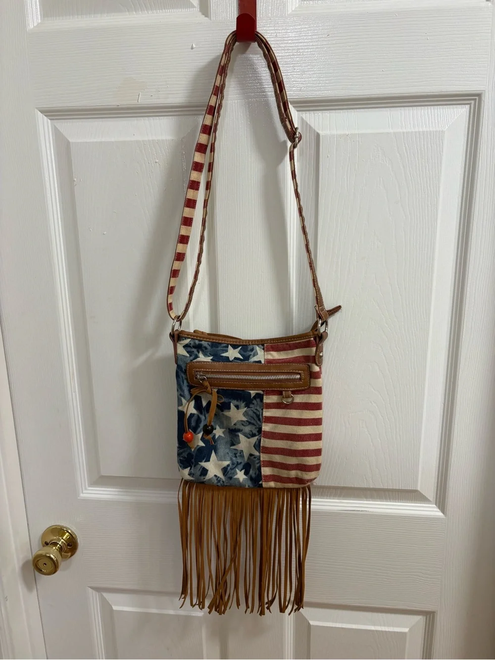 Retro crossbody Stars and Stripes bag with fringe, note striped underside strap
